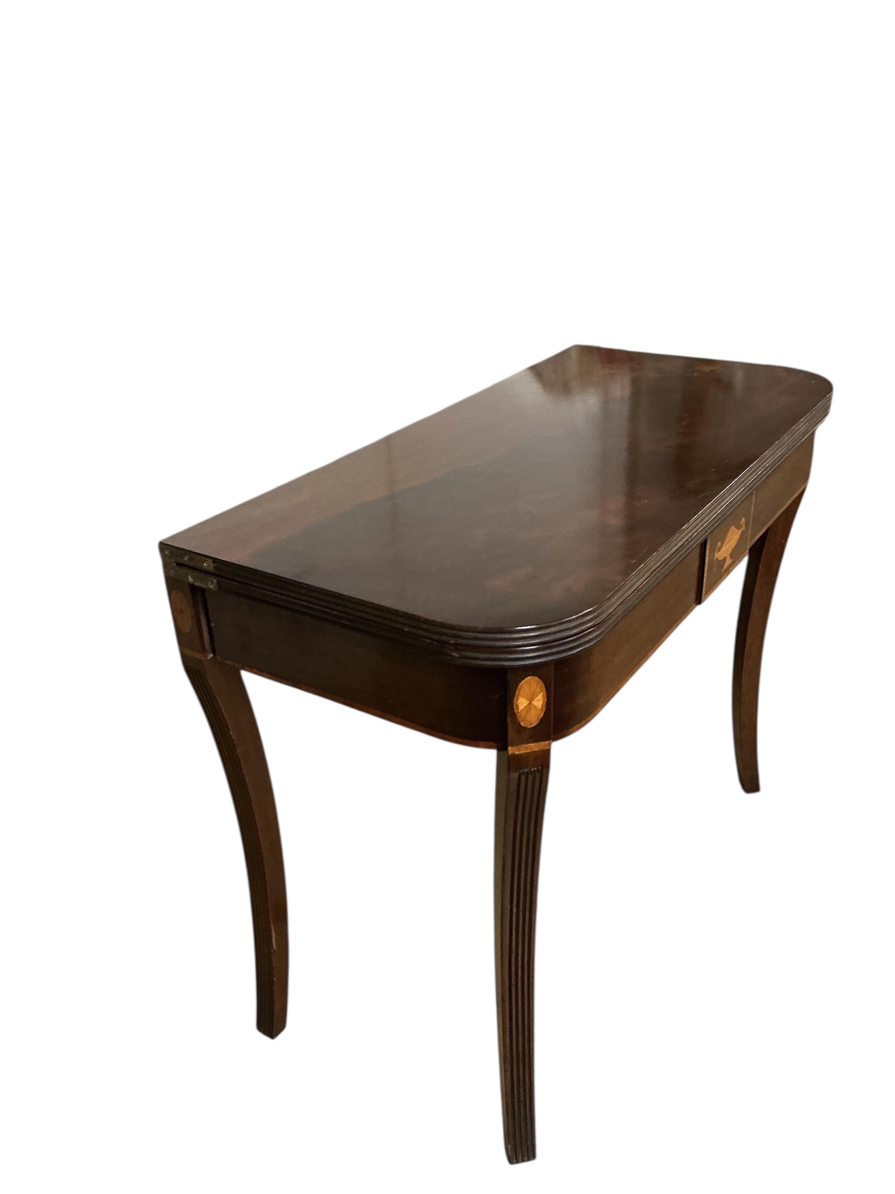 A George III style inlaid mahogany folding tea table, width 91cm, depth 44cm, height 72cm